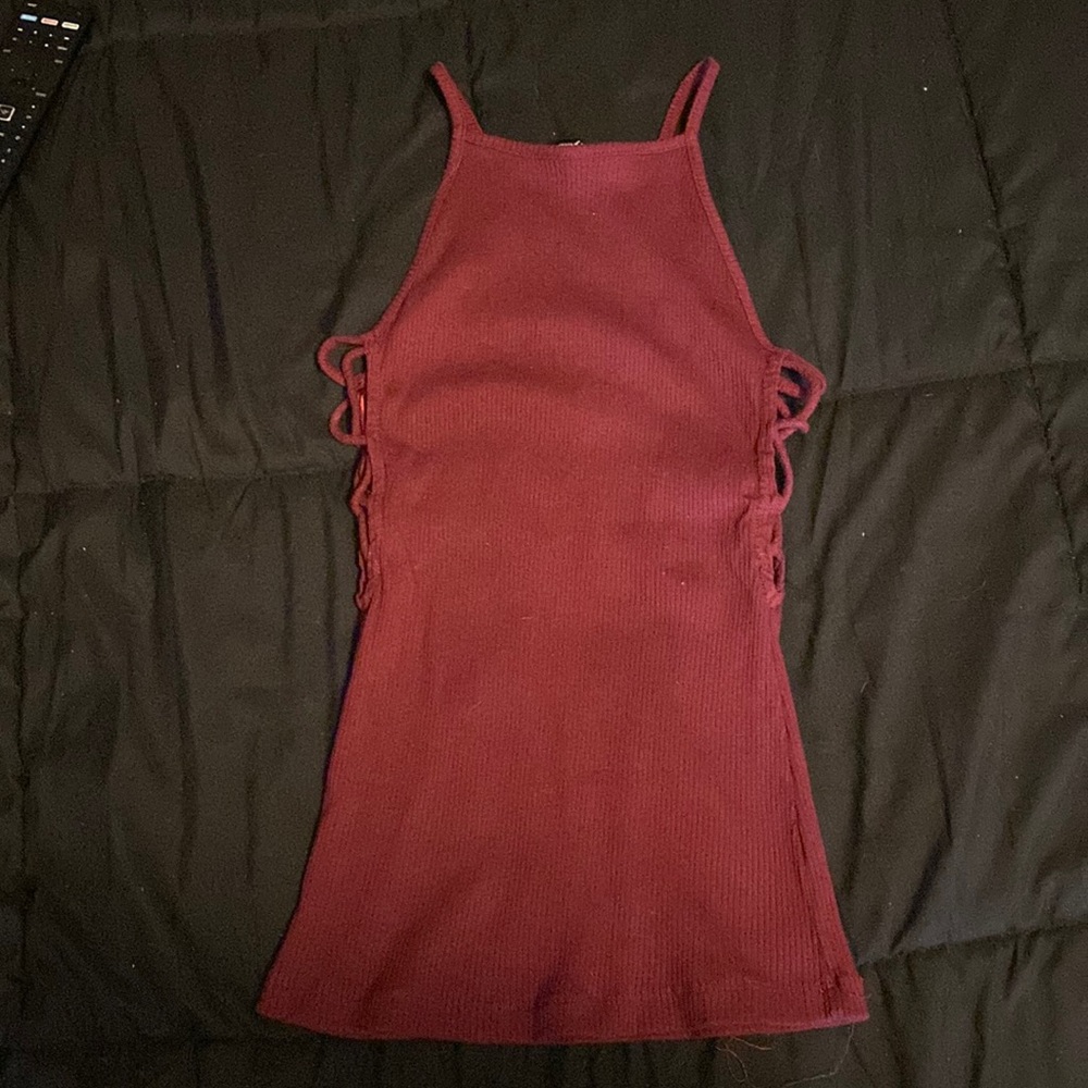Ambiance fitted maroon shirt size small, the sides have crossly opens